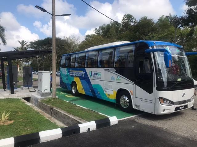 A group of buses parked in front of a buildingAI-generated content may be incorrect.
